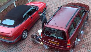 Saab 900 and Vauxhall Astra being washed by pixies