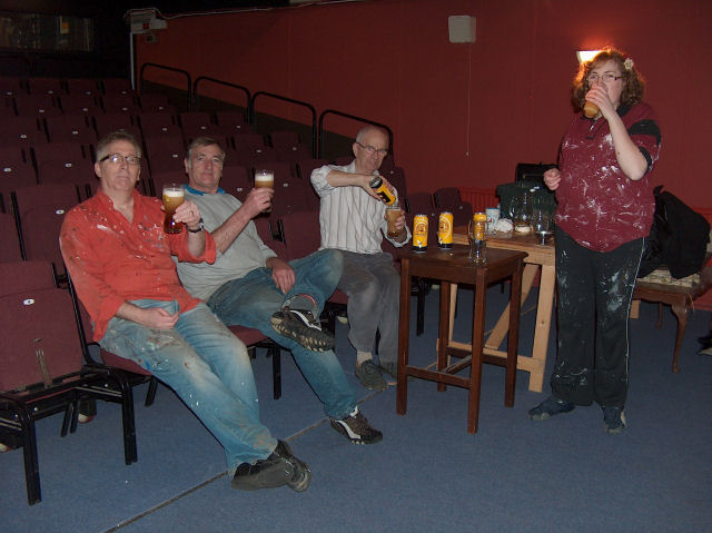 Construction team celebrating completion of the set